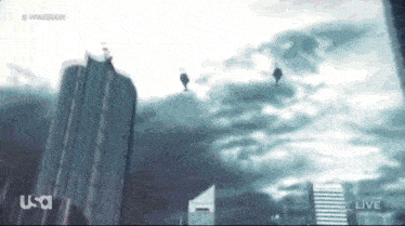 a group of people are flying through the air in front of a cloudy sky with the letters usa on the bottom