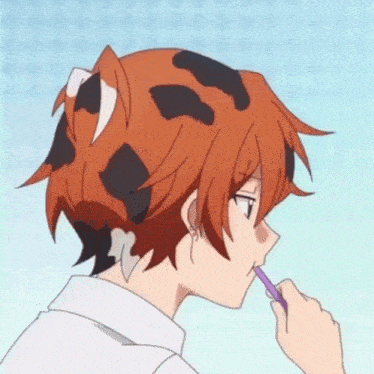 a person with a cat ear on their head is brushing their teeth