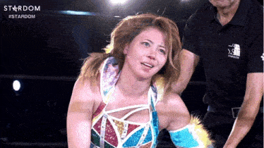 a woman in a wrestling ring with the word stardom on the top
