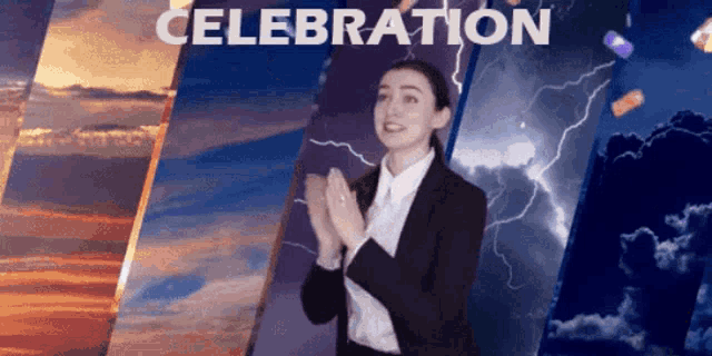 a woman in a suit applauds in front of a celebration banner