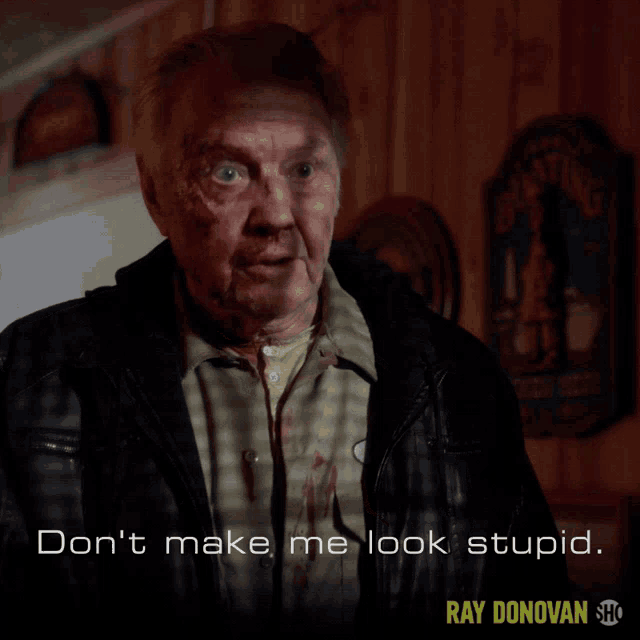 a poster for ray donovan shows an older man with blood on his shirt