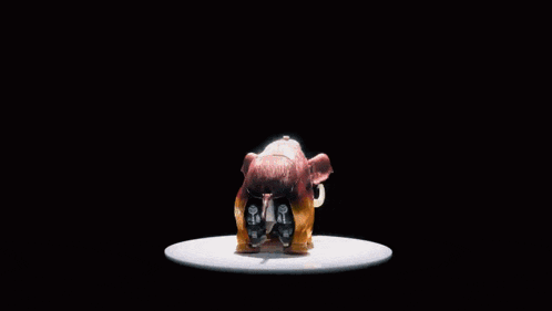 a robot with horns is standing in front of a black background with japanese writing