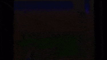 a colorful rainbow is glowing in the dark on a black background