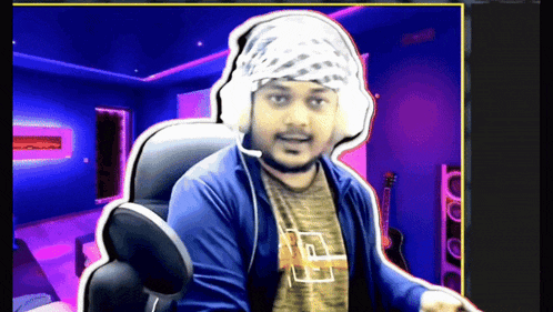 a man wearing headphones and a bandana looks at the camera