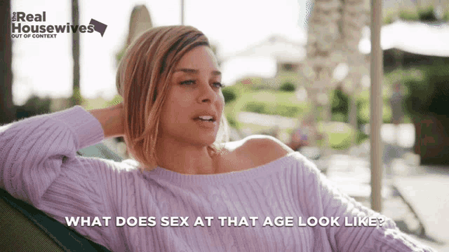 a woman in a purple sweater is sitting on a chair with the words what does sex at that age look like