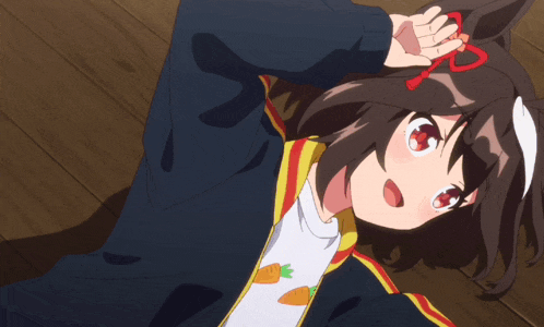 a girl with a carrot on her shirt is laying on a wooden floor