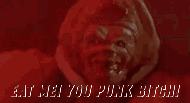 a red background with the words eat me you punk bitch on it
