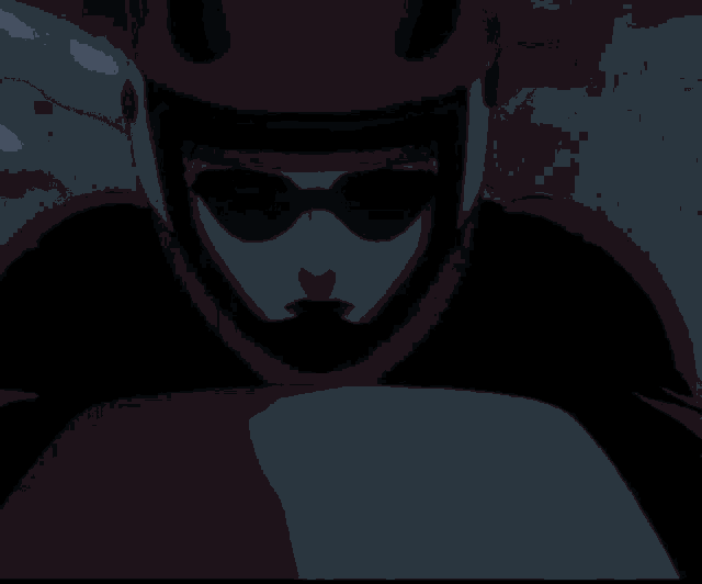 a close up of a person wearing a helmet and goggles
