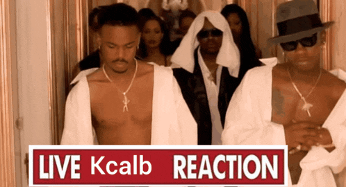 a group of men standing next to a sign that says " live kcalb reaction "
