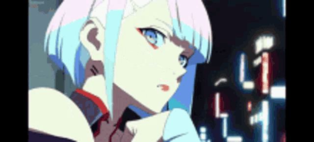 a close up of a person 's face with a blue and pink hair style .