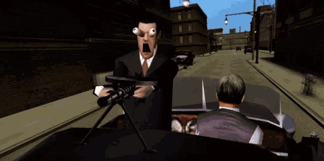a man in a suit and tie is holding a gun in front of a man in a car
