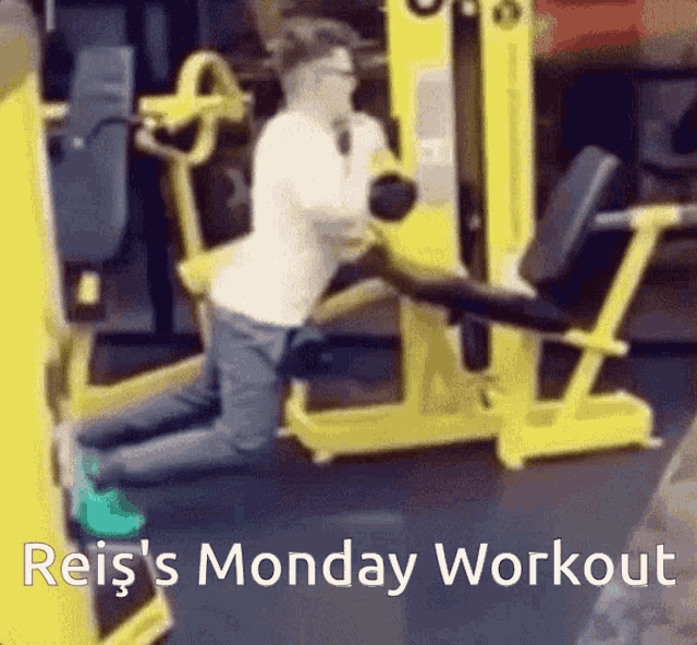 a man is kneeling on a machine in a gym with the words reis 's monday workout below him