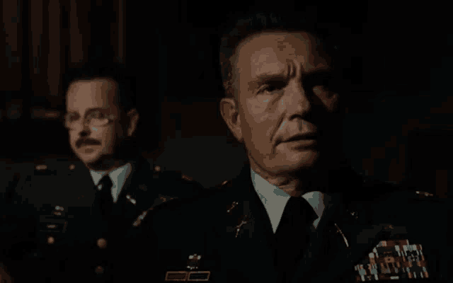 a man in a military uniform has a badge that says ' a ' on it