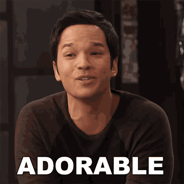 a man in a brown shirt with the word adorable on the bottom