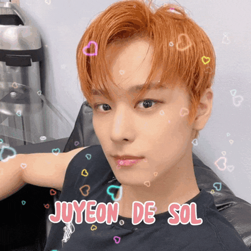 a young man with red hair and the name juyeon de sol