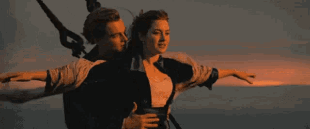 a man and a woman are flying in the air with the hashtag #zo written below them