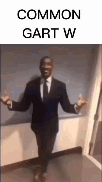 a man in a suit and tie is dancing in a hallway with the words common gart w on the bottom