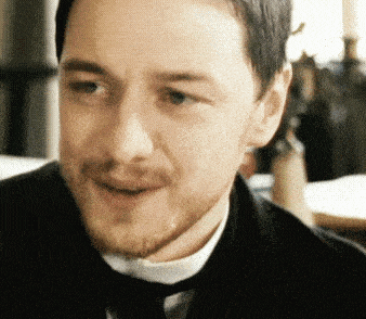 a man with a beard wearing a suit and tie