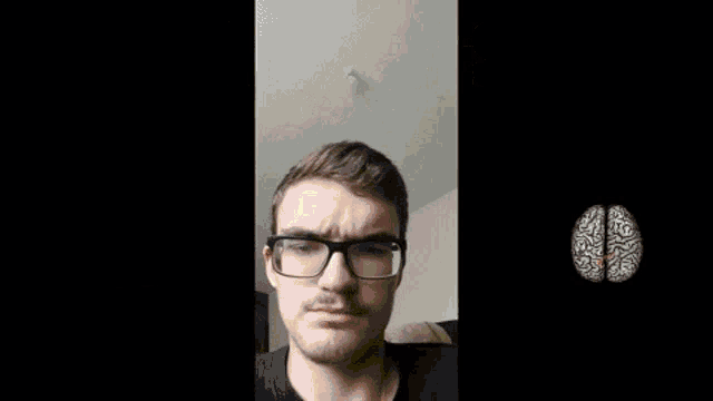 a man with glasses has a fireball coming out of his head and the words le cerveau est casse above him