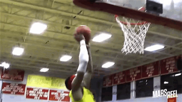 a basketball going through a hoop with the word mars reel on the bottom right