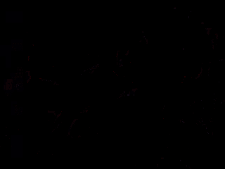 a man and a woman are standing next to each other in a bar .