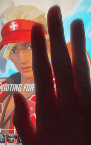 a person 's hand is visible in front of a screen that says waiting for on it