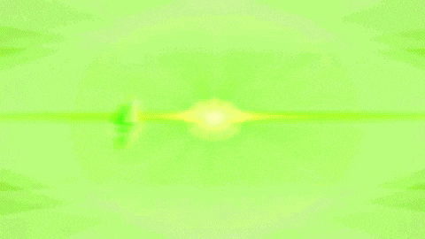 a woman in a red dress and black boots is dancing in a green circle
