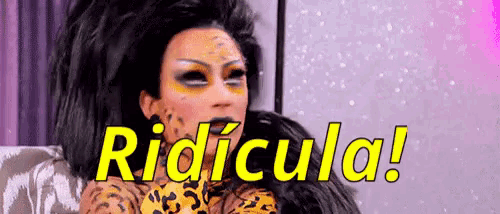 a woman with a leopard print on her face is sitting on a couch with the words ridicula in yellow letters behind her