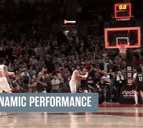 a basketball game is being played in front of a crowd and a banner that says dynamic performance