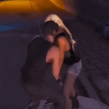 a man is kneeling down next to a woman in a video game .