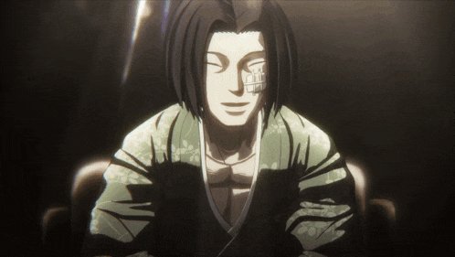 a man in a kimono with his eyes closed is smiling