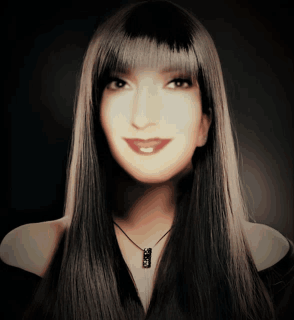 a woman with long hair and a black necklace