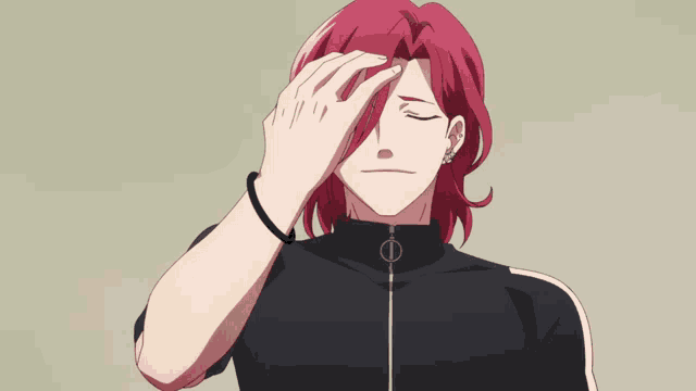 a man with red hair is wearing a black top