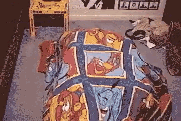a pixelated image of a bed with a blanket that says ' disney ' on it