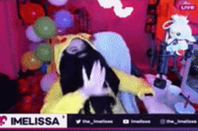 a person in a costume is laying on a chair with balloons .