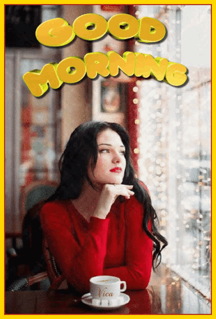 a woman in a red sweater sits at a table with a cup of coffee and the words good morning written above her