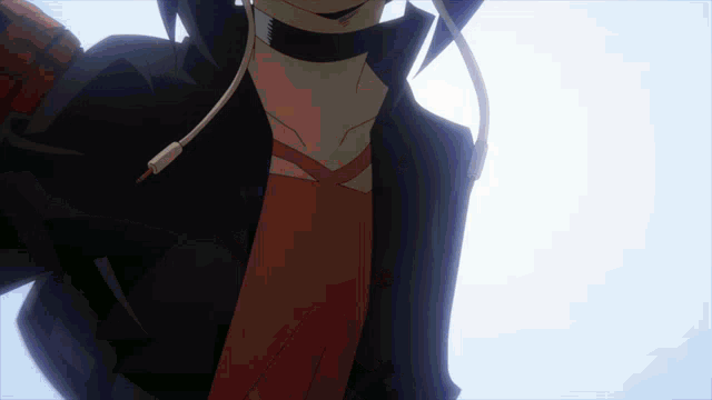 a close up of a person wearing headphones and a jacket