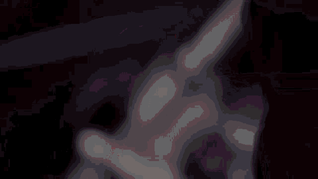 a blurry image of a person 's face with a red background
