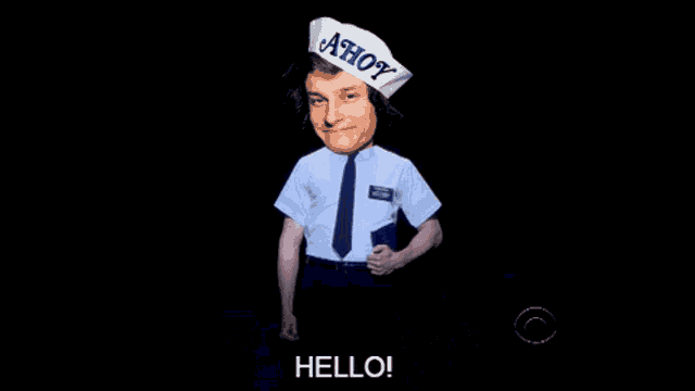 a man wearing a hat that says ahoy holds a book in his hands