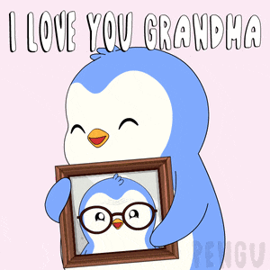 a penguin is holding a framed picture of itself with the words " i love you grandma " below it
