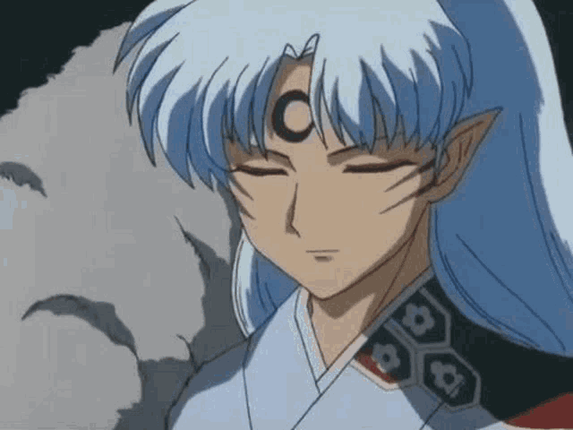 a close up of a cartoon character with long white hair and a moon on his head .