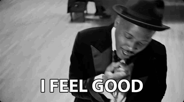 a black and white photo of a man in a suit and hat with the words i feel good below him
