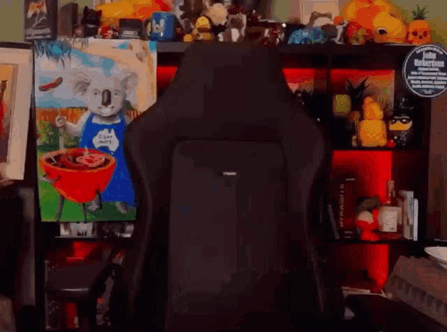 a painting of a koala bear cooking on a grill is behind a chair