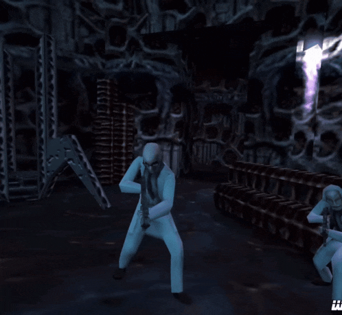 a man in a white suit holding a gun in a dark room