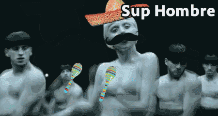 a man with a sombrero on his head and a mustache is surrounded by a group of men