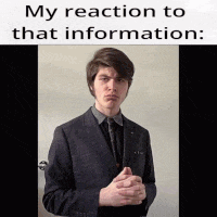 a man in a suit and tie is standing in front of a door with his hands folded in front of him .
