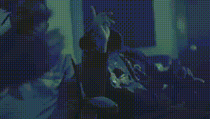 a blurry picture of a person 's hand reaching out towards a wall .