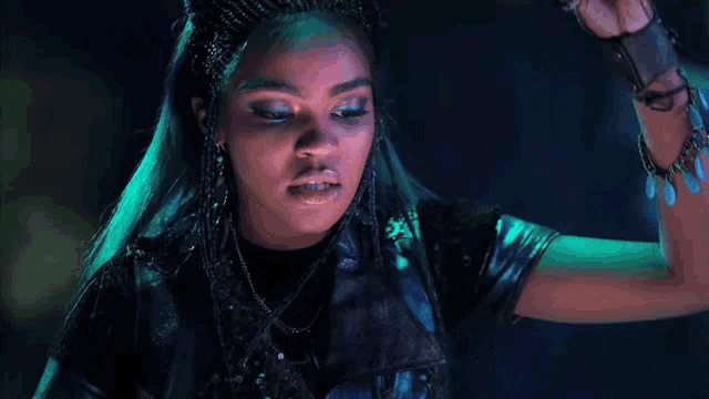 a woman is wearing a black jacket and a crown