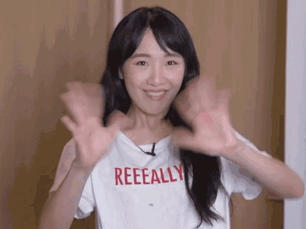 a woman wearing a white t-shirt that says reeeally
