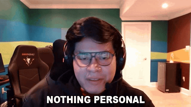 a man wearing glasses and a headset says nothing personal